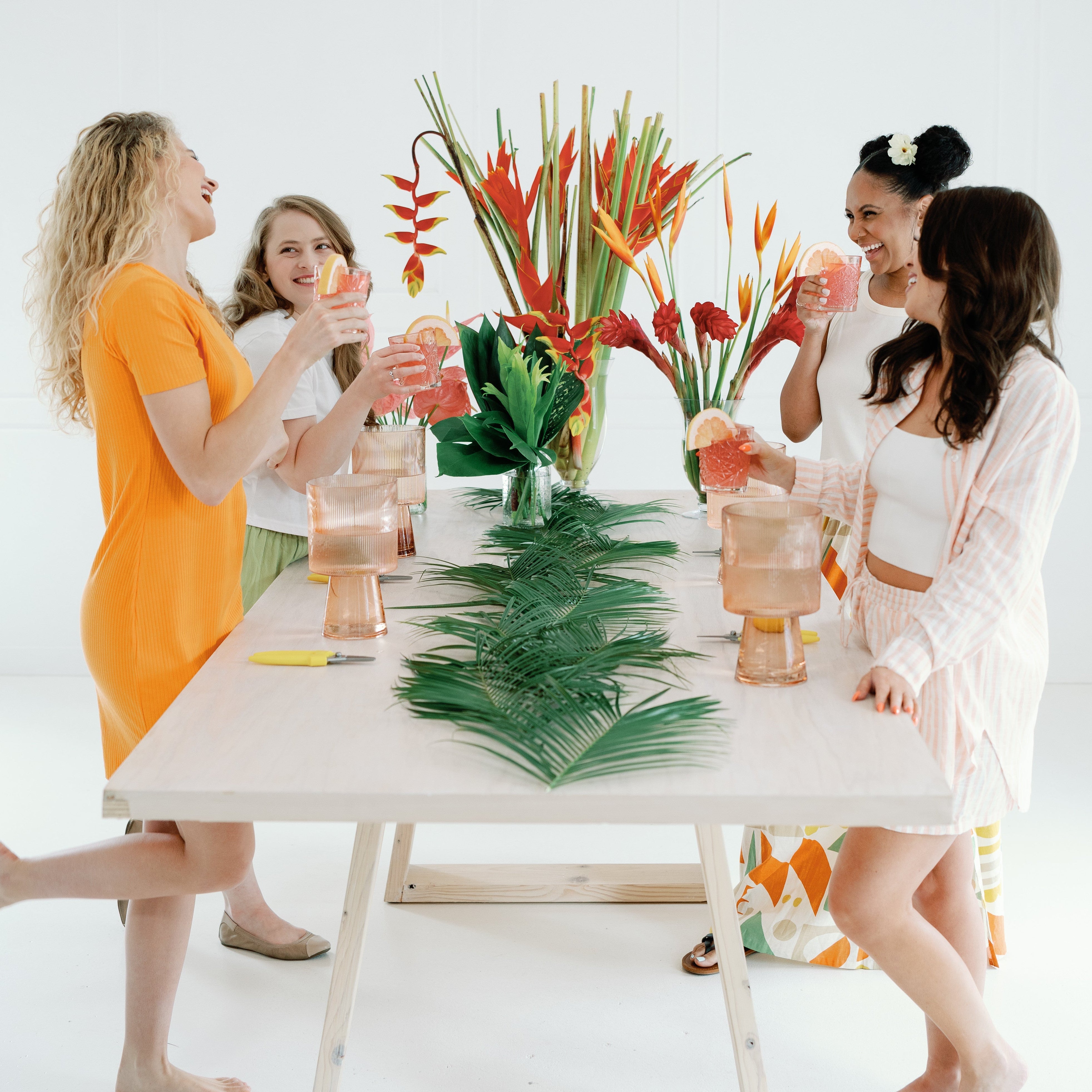 girls gathering around flowers